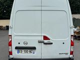 a white van that is parked in a parking lot