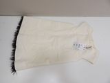 an image of a white bag with a black feather on it