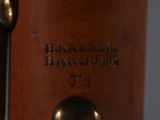 a close up of a wooden object with a metal handle