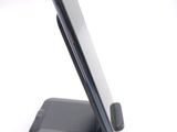 a cell phone that is sitting on top of a stand