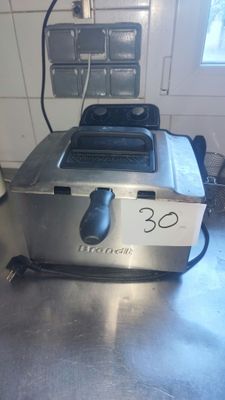 a toaster that is sitting on a counter in a kitchen