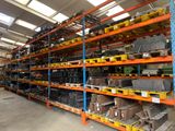 the warehouse shelves are full of different types of metal items