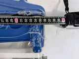 someone is measuring the height of a suitcase with a tape measure