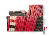 many books stacked on top of each other on a shelf