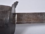 a close up of a knife on a white surface