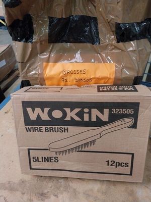 a box with a brush on top of it sitting on a table
