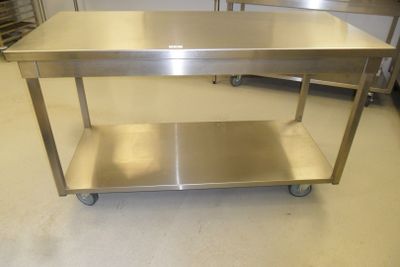a stainless steel table with a shelf underneath it
