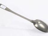 a spoon with a handle that has a tag on it