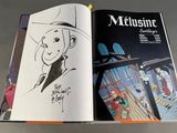 a book with a drawing of a man in a top hat