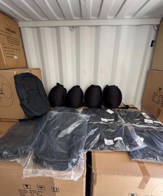 many bags of luggage in the back of a moving truck