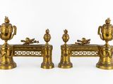 two golden vases sitting on top of a table
