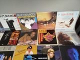 a lot of music cds on a table