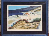 framed painting of a view of a village by the sea