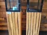 two wooden boxes with glass on them on the floor