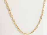 a close up of a gold chain necklace on a mannequin mannequin