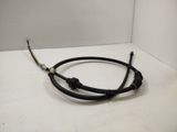a close up of a black brake cable on a white surface