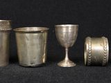 a lot of silver items that are on a table