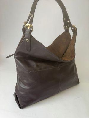 brown leather handbag on a white background with a white background