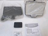 a bag and a cell phone sitting on a table