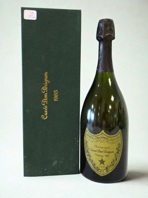 a bottle of champagne next to a green box