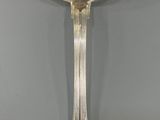 a silver spoon with a spoon handle and a spoon in the middle of it