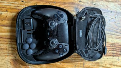 a black case with two controllers inside of it on a table