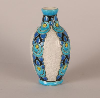 a blue and white vase sitting on a table