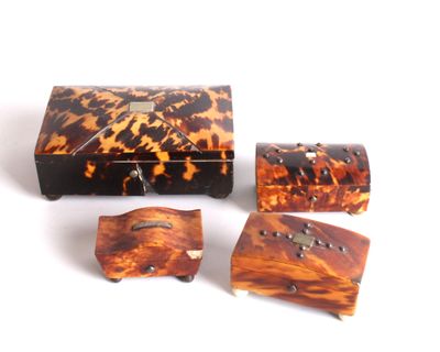 a tortoise shell box and four pieces of jewelry