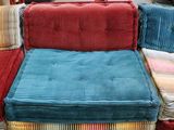 a couch made out of a pallet in a warehouse