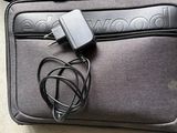 a bag with a charger attached to it on the floor