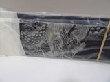 a black and white picture of a bag with a design on it