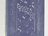 an old book with stars on it sitting on a table