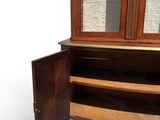 a wooden cabinet with a mirror on top of it