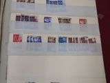 a lot of different stamps on the paper on the table