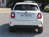 a small white car parked in a parking lot