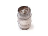 an old metal keg with a metal cap on a white surface