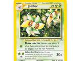 a close up of a pokemon card on a white surface