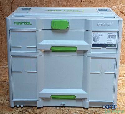 une image représentant une boîte à outils en plastique verte et blanche posée sur une surface en bois