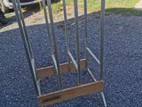 a metal rack that has a bunch of knives on it