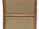 a close up of a piece of wood with a piece of fabric on it