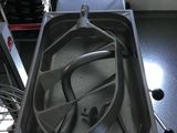 a metal pan with a handle on it in a kitchen
