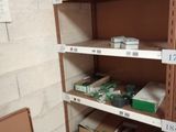 a shelf with boxes and boxes on it in a room