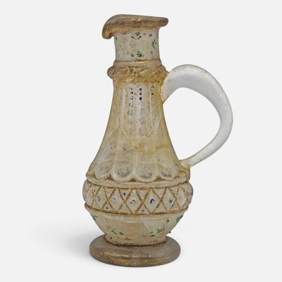 an image of a ceramic pitcher on a stand