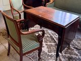 two chairs and a table in a living room