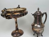 a silver tea pot and a silver coffee pot