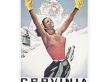 affiche représentant une femme en tenue de ski levant les bras en l'air, avec une montagne en arrière-plan