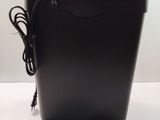 a small black box with a charger on top of it
