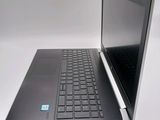 a laptop that is open on a white surface