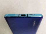 a close up of the back of a blue phone