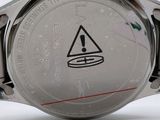 an image of a close up of a watch on a white surface